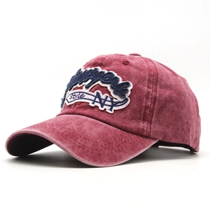 Close-up of vintage washed cotton baseball cap with detailed NY embroidery and curved brim