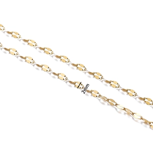 Macro detail of 2mm gold plated stainless steel curb chain with flat oval links for jewelry
