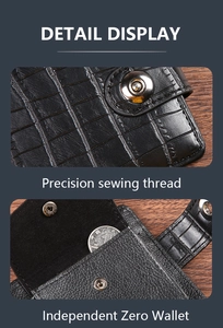 Detail view of crocodile texture men's wallet featuring a metal snap and coin pocket