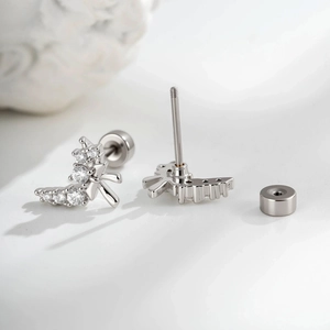 Elegant bow-shaped stud earrings with micro-set cubic zirconia in a silver-tone finish