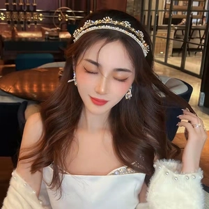 Elegant set featuring a gold pearl headband with matching earrings and ring for women
