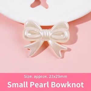 Close-up of pearl white bow resin bead measuring 23x29mm for DIY jewelry making