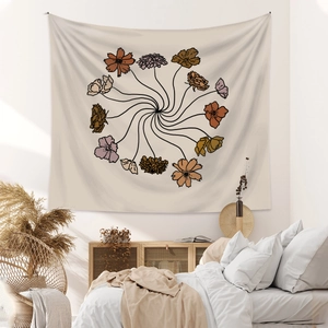Close-up of minimalist floral bohemian wall tapestry in a cozy modern bedroom setting