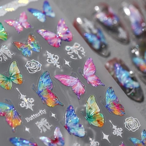 Detail of iridescent butterfly nail stickers with holographic laser effects for nail art