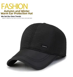 Detail of black winter baseball cap with quilted wave texture and fleece ear flaps