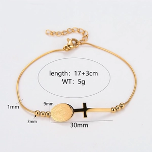 Minimalist gold stainless steel bracelet with virgin Mary medal and cross pendant charms