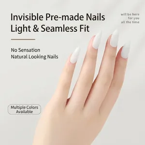 White almond-shaped press-on nail tips with glossy finish shown on model's hand