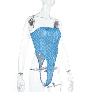 Close-up of blue printed strapless bodysuit featuring white geometric patterns and high-cut