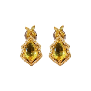 Luxurious gold teardrop earrings with yellow pear-cut gemstone and small diamonds