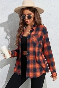 Detailed view of long-sleeve flannel plaid shirt with button closure and chest pocket
