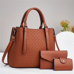 Three-piece brown quilted tote bag set with matching wallet and pouch for women
