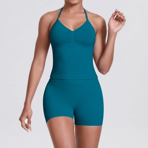 Detailed view of peacock blue halter neck yoga bra and high waist fitness shorts set