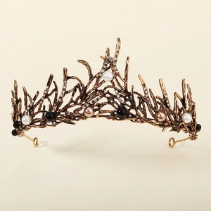 Detail of vintage bronze tiara with branch design, multi-colored pearls and crystals