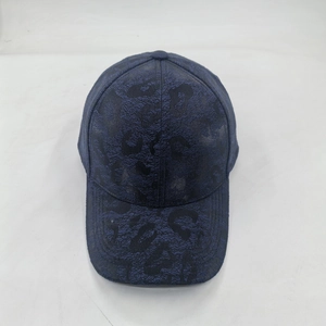 Detailed top view of navy blue baseball cap with 3D leopard jacquard textured fabric