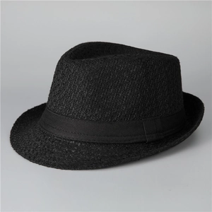 Detail of black wool fedora hat featuring a stylish woven texture and decorative ribbon band