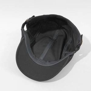 Top view of dark grey vintage ivy cap showing inner structure and bronze side buckles