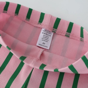Pink and green striped ribbed knit flare pants for girls with 95% cotton tag detail