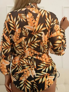 Back view of a long sleeve mesh beach cover-up featuring orange tropical leaf prints