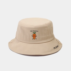 Detailed close-up of beige cotton bucket hat with MS. CARROT vegetable embroidery