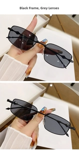 Detail of retro rectangular sunglasses featuring black metal frames and wave-textured temples