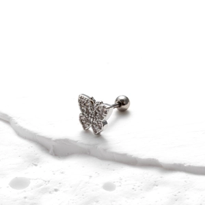 Macro shot of silver butterfly stud earring with clear crystals and screw back post