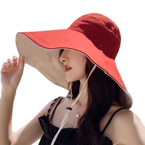 Red wide brim sun hat for women with beige interior and adjustable chin strap