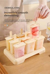 Detail of 8-cell popsicle mold set with fresh fruit ice pops on a wooden table