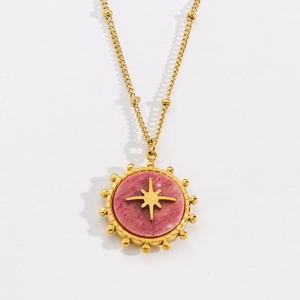 Bohemian gold titanium necklace featuring a pink stone pendant with a starburst motif