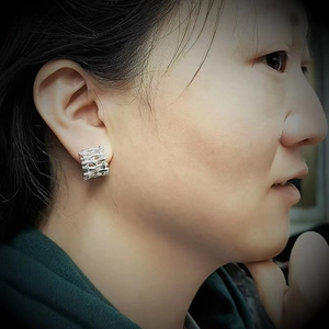 Chic silver earrings with woven texture and artistic wavy design for daily wear