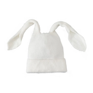 Detailed view of soft knit texture and long bunny ears on a white winter beanie