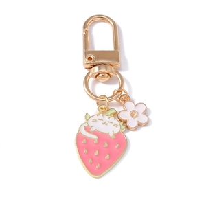 Cute white cartoon cat on pink strawberry keychain with gold clasp and white flower charm