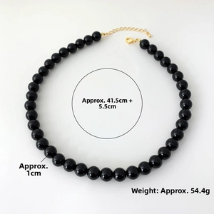 Detail view of 1cm black onyx beads necklace with 41.5cm length and gold clasp