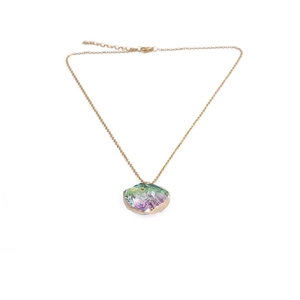Detail view of gold chain necklace with colorful iridescent crystal stone pendant