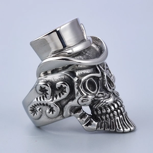 Detailed view of punk stainless steel skull ring with top hat and embossed scrollwork