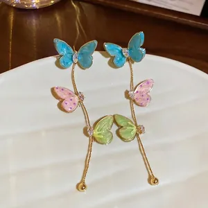 Enameled butterfly tassel earrings with colorful zircons and golden chain finish