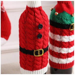 Detail of Christmas wine bottle covers featuring cable knit texture and belt buckle
