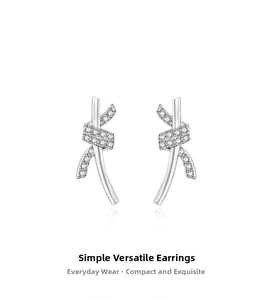 Detailed view of S999 silver knotted stud earrings with sparkling pavé cubic zirconia