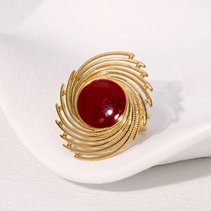 Retro gold stainless steel ring featuring a large red enamel center with spiral texture