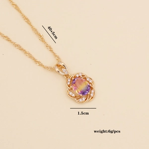 Close-up of golden sunflower pendant with colorful center gem and dimensions