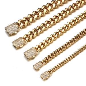 Detailed macro view of five gold-plated Cuban chains in various widths with CZ stone clasps