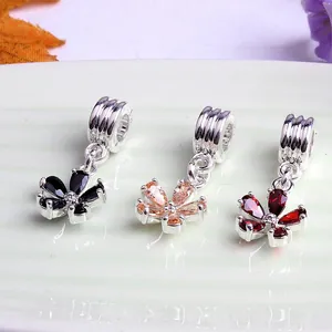 Three five-petal flower charms with colorful crystals for DIY jewelry making