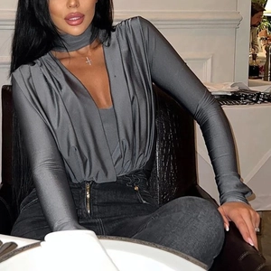 Detailed view of grey V-neck satin bodysuit with halter strap and ruching detail