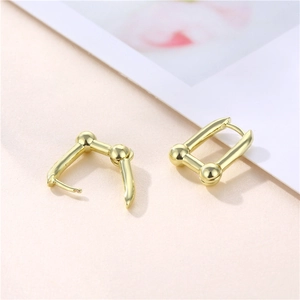 French minimalist gold U-shaped horseshoe earrings with polished spherical beads for women