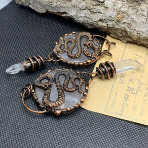 Gothic antique bronze snake earrings with translucent stone and quartz crystal points