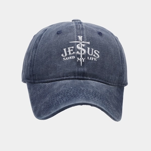 Detailed close-up of dark blue washed cotton baseball cap with Jesus Saved My Life print