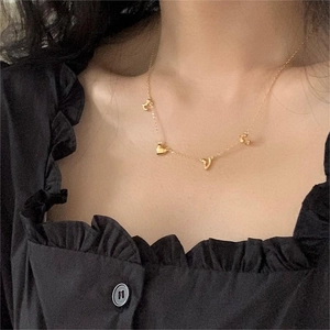 Elegant 925 sterling silver golden LOVE letter necklace on model for a minimalist look
