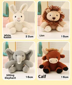 Detailed view of hand-knitted animal plush toys including a rabbit, lion, elephant, and calf