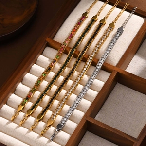 Detail of 18K gold and silver tennis bracelets with white cubic zirconia in a jewelry box