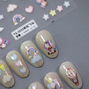 3D embossed nail art stickers featuring rainbow and unicorn designs for DIY manicure