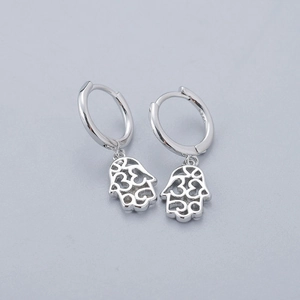 Close-up of S925 sterling silver Hamsa hand dangle earrings with hollow design